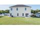 Spacious backyard with a well-maintained lawn and rear exterior of the house at 1031 Snowberry Dr., Longs, SC 29568