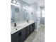 Bright bathroom with a dual sink vanity and tile floor at 1031 Snowberry Dr., Longs, SC 29568