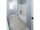 Clean bathroom showcasing tile floors and a tub with a shower at 1031 Snowberry Dr., Longs, SC 29568