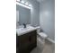 Powder room with modern vanity, white counter, and brushed nickel faucet at 1031 Snowberry Dr., Longs, SC 29568