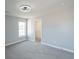 An inviting bedroom with light gray walls and plush carpeting, featuring a ceiling fan and a walk-in closet at 1031 Snowberry Dr., Longs, SC 29568