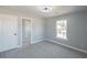 Bright bedroom with a closet featuring gray carpet and neutral paint at 1031 Snowberry Dr., Longs, SC 29568