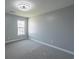 A serene bedroom featuring neutral paint, soft carpet, a window with natural light, and modern ceiling fan at 1031 Snowberry Dr., Longs, SC 29568