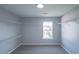 Spacious walk-in closet with built-in shelving and a bright window at 1031 Snowberry Dr., Longs, SC 29568