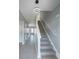 Entryway featuring tile floors, staircase, and modern pendant lighting at 1031 Snowberry Dr., Longs, SC 29568