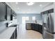 Modern kitchen with stainless steel appliances and dark cabinets at 1031 Snowberry Dr., Longs, SC 29568