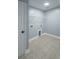 A convenient laundry room with tiled floors, a storage shelf, and washer/dryer hookups at 1031 Snowberry Dr., Longs, SC 29568