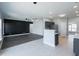 Open concept living room and kitchen with modern finishes and plenty of natural light at 1031 Snowberry Dr., Longs, SC 29568