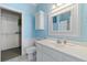 Bright bathroom features a vanity, cabinet, and toilet with an open closet to the left at 107 Waterway Crossing Ct., Little River, SC 29566