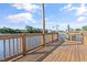 A serene view of a private wooden dock and water access on a sunny day at 107 Waterway Crossing Ct., Little River, SC 29566