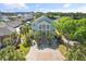 Stunning two-story home with a grand entrance, lush landscaping, and a beautiful view of the waterway and bridge at 107 Waterway Crossing Ct., Little River, SC 29566