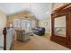 Lofted room features a large sitting area with a leather sofa, vaulted ceilings, and elegant furnishings at 107 Waterway Crossing Ct., Little River, SC 29566