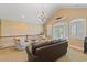Cozy upstairs living room with vaulted ceiling and transom windows, offering natural light at 107 Waterway Crossing Ct., Little River, SC 29566