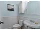 Charming powder room with beadboard paneling, creating a clean and classic look at 107 Waterway Crossing Ct., Little River, SC 29566