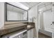 Bathroom features a laundry area with front loading washer and dryer and granite countertop at 1105 S Ocean Blvd. # 724, Myrtle Beach, SC 29577