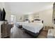 Bright bedroom featuring two queen beds, wood floors, TV, dresser, and balcony access at 1105 S Ocean Blvd. # 724, Myrtle Beach, SC 29577