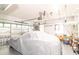 Functional garage with a car covered by a sheet, overhead storage, painted floor and a work area at 111 Rose Water Loop, Myrtle Beach, SC 29588