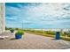 Relaxing beachside patio with lounge chairs, greenery, and panoramic ocean views at 1207 South Ocean Blvd. # 51106, Myrtle Beach, SC 29577