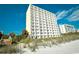 Beachfront condo with multiple balconies, palm trees, and nearby beach access at 1207 South Ocean Blvd. # 51106, Myrtle Beach, SC 29577