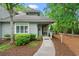 Charming home entrance featuring a covered porch, well-manicured landscaping, and a welcoming pathway at 1221 Tidewater Dr. # 2811, North Myrtle Beach, SC 29582