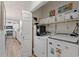 Convenient laundry area with washer, dryer, shelving and easy access to the kitchen at 1221 Tidewater Dr. # 2811, North Myrtle Beach, SC 29582