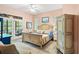 Comfortable main bedroom with an ornate bed, neutral walls, a ceiling fan, and an outdoor view at 1221 Tidewater Dr. # 2811, North Myrtle Beach, SC 29582