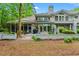 Rear exterior showcasing screened porch, deck, and beautiful windows bringing the outdoor beauty into the home at 1221 Tidewater Dr. # 2811, North Myrtle Beach, SC 29582