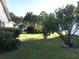 Spacious, grassy backyard with mature trees and lush hedges enhancing privacy and outdoor enjoyment at 131 Goodale Dr., Longs, SC 29568