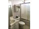 Functional bathroom with a tub shower combo, single sink vanity, and floral wallpaper at 131 Goodale Dr., Longs, SC 29568