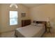 Comfortable bedroom with a quilted bedspread, side table, and natural light at 131 Goodale Dr., Longs, SC 29568