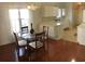 Cozy dining area featuring a glass table, four chairs, and bright natural lighting at 131 Goodale Dr., Longs, SC 29568