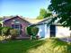 Inviting single-story home featuring a brick facade, siding, manicured landscaping, and an attached garage at 131 Goodale Dr., Longs, SC 29568