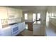 Well-equipped kitchen with white cabinets, updated appliances, and eat-in breakfast area at 131 Goodale Dr., Longs, SC 29568
