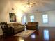 Bright living room with hardwood floors, vaulted ceilings, comfortable seating, and lots of natural light at 131 Goodale Dr., Longs, SC 29568