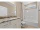 Bathroom featuring granite counters, tiled floor, and a shower/tub combo at 144 Puffin Dr. # 2A, Pawleys Island, SC 29585