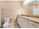 Bathroom featuring granite counters, tiled floor, and white cabinets at 144 Puffin Dr. # 2A, Pawleys Island, SC 29585