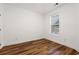 Bright bedroom with wood floors and a window at 144 Puffin Dr. # 2A, Pawleys Island, SC 29585