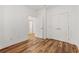 Bedroom with wood floors, white trim, and white closets at 144 Puffin Dr. # 2A, Pawleys Island, SC 29585