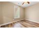 Bedroom with wood floors, a window, and a ceiling fan at 144 Puffin Dr. # 2A, Pawleys Island, SC 29585