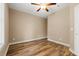 Bedroom with ceiling fan, window, and hard wood floors at 144 Puffin Dr. # 2A, Pawleys Island, SC 29585
