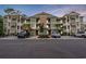Inviting condo complex with private balconies, ample parking, and mature landscaping at 144 Puffin Dr. # 2A, Pawleys Island, SC 29585