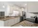 Well-equipped kitchen featuring granite countertops, stainless appliances, and white cabinetry at 144 Puffin Dr. # 2A, Pawleys Island, SC 29585