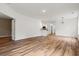 Expansive living room with hardwood floors, neutral paint, open layout, and access to kitchen at 144 Puffin Dr. # 2A, Pawleys Island, SC 29585
