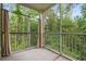 Cozy screened porch features views of the surrounding trees and landscaping at 144 Puffin Dr. # 2A, Pawleys Island, SC 29585