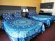Cozy bedroom with two queen beds featuring blue mandala bedding and dark wood accents at 1501 S Ocean Blvd. # 1112, Myrtle Beach, SC 29577