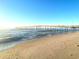 Long wooden pier stretching over the ocean with a sandy beach in the foreground at 1501 S Ocean Blvd. # 1112, Myrtle Beach, SC 29577