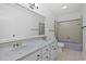 A bathroom featuring a large vanity, dual sinks, a toilet, and a bathtub with tile surround at 1590 Landing Rd., Myrtle Beach, SC 29577