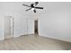 A spacious bedroom featuring wood floors, ceiling fan, closet, and white walls at 1590 Landing Rd., Myrtle Beach, SC 29577