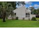 Back of home featuring a spacious deck and mature landscaping at 1590 Landing Rd., Myrtle Beach, SC 29577