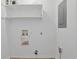 Utility room with shelving and connections for a washer and dryer at 1590 Landing Rd., Myrtle Beach, SC 29577